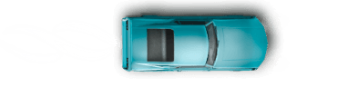 Aerial view of muscle car driving down a road.