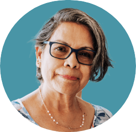 Image of patient Eileen, a latina woman in her 60s wearing glasses
